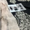 elegant black embroidered kurta set with beige shawl for women